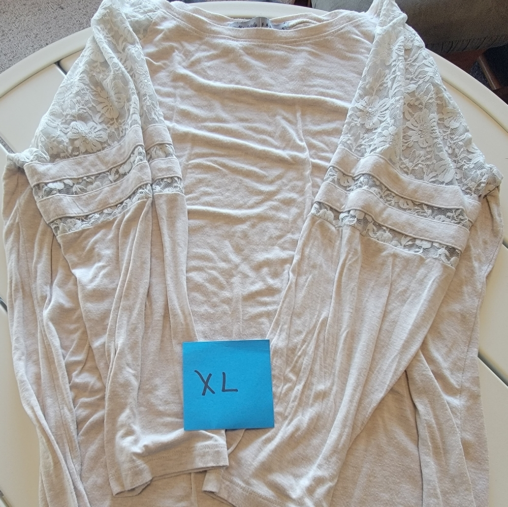 Beige colored top, quarter sleeve, lace